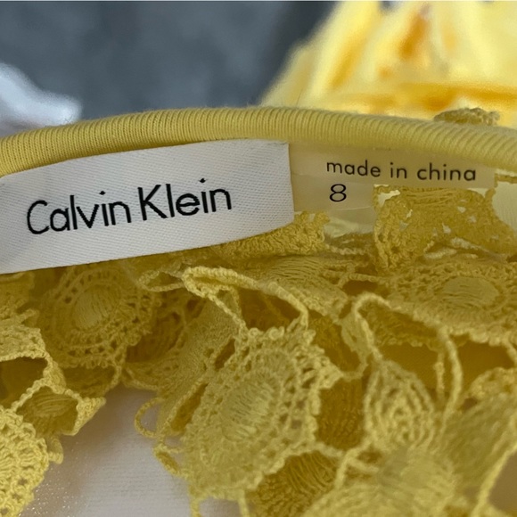 Calvin Klein yellow midi dress with pattern at the top, light and flowy material - Picture 3 of 3
